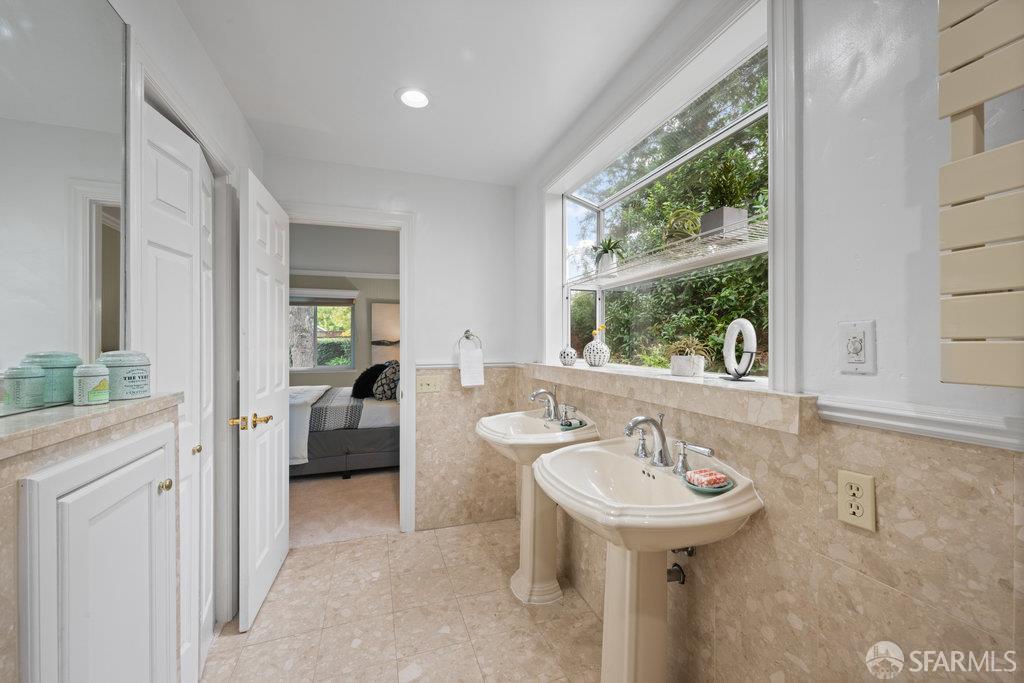 4572 Ross Gate Way Pleasanton, CA 94566 - Photo 35 of 58 a bathroom with a sink and a mirror