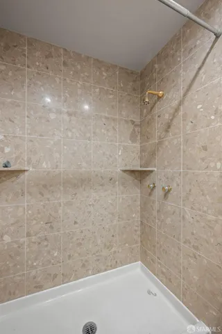 a view of a white house with a big yard and large trees