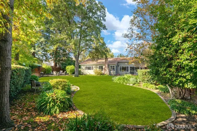 a backyard of a house with lots of green space