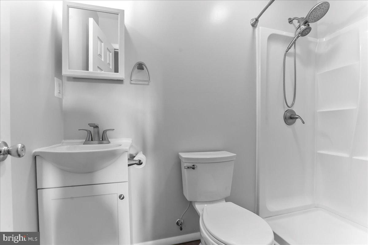 158 Firetower Road Port Deposit, MD 21904 - Photo 23 of 50 a white toilet sitting next to a bathroom sink
