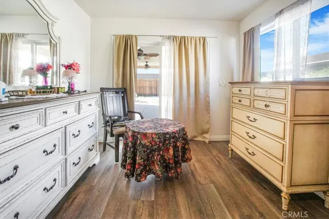 a bathroom with a granite countertop sink a toilet and a shower curtain