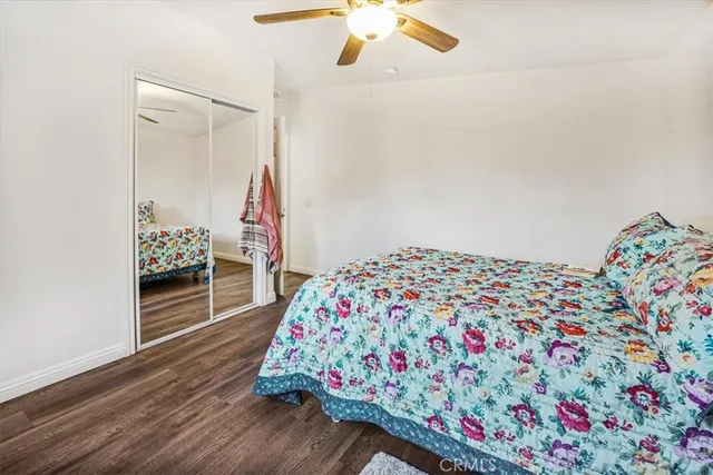 a bedroom with bed and a chandelier