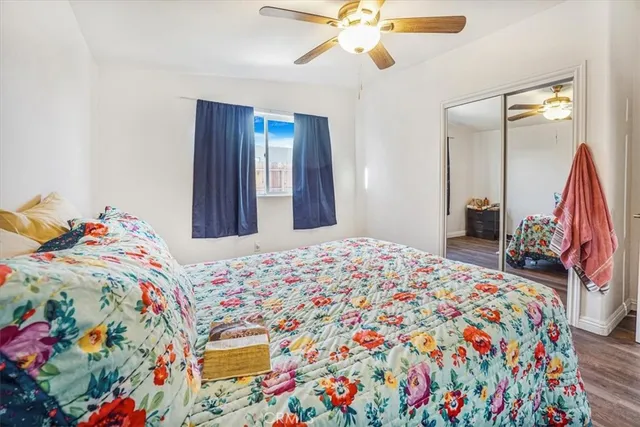 a bedroom with bed and window