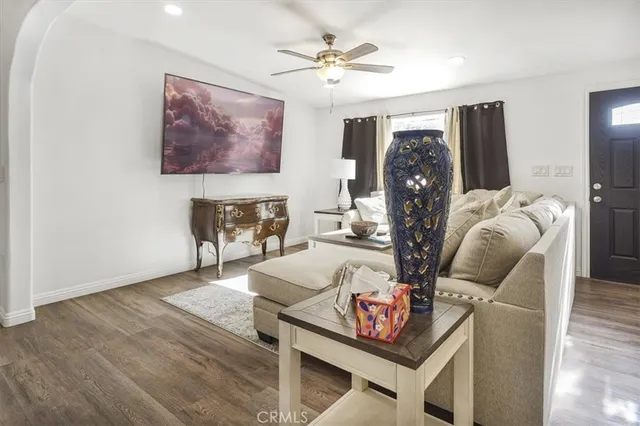 a view of a blue house with a yard