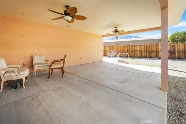 a view of a porch with furniture and a window