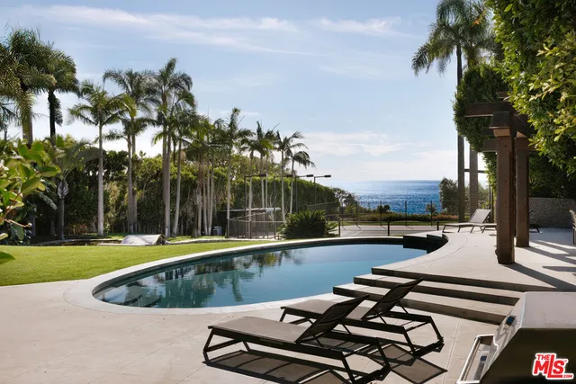 a front view of a house with a garden and porch