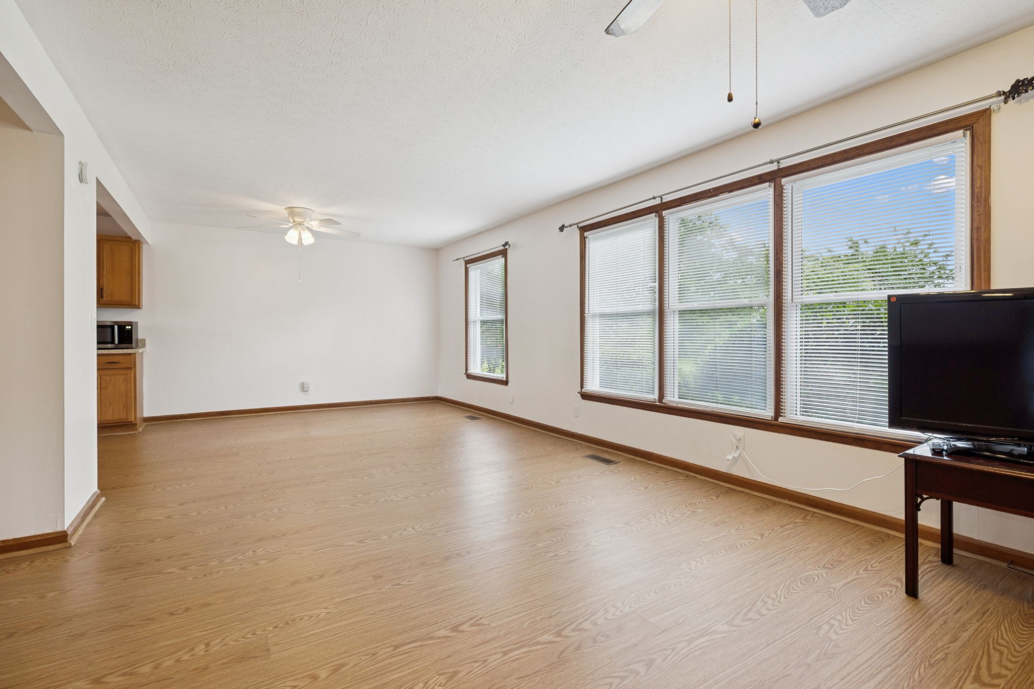 115 White Road Portland, TN 37148 - Photo 15 of 44 a view of an empty room with a window and wooden floor