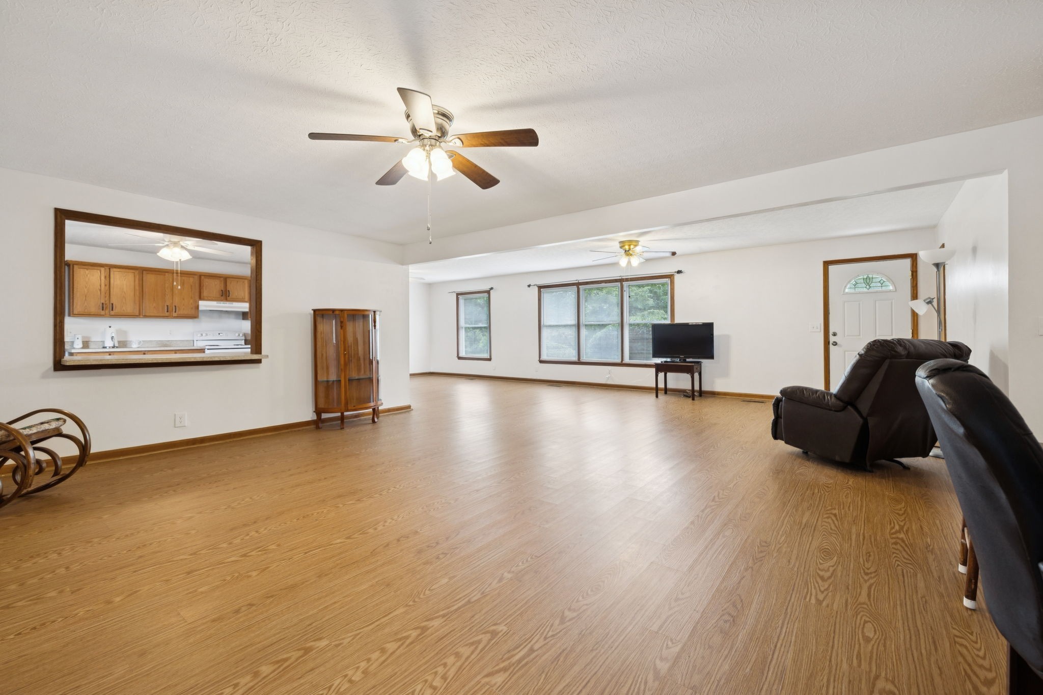 115 White Road Portland, TN 37148 - Photo 17 of 44 a view of a livingroom with furniture a ceiling fan and wooden floor