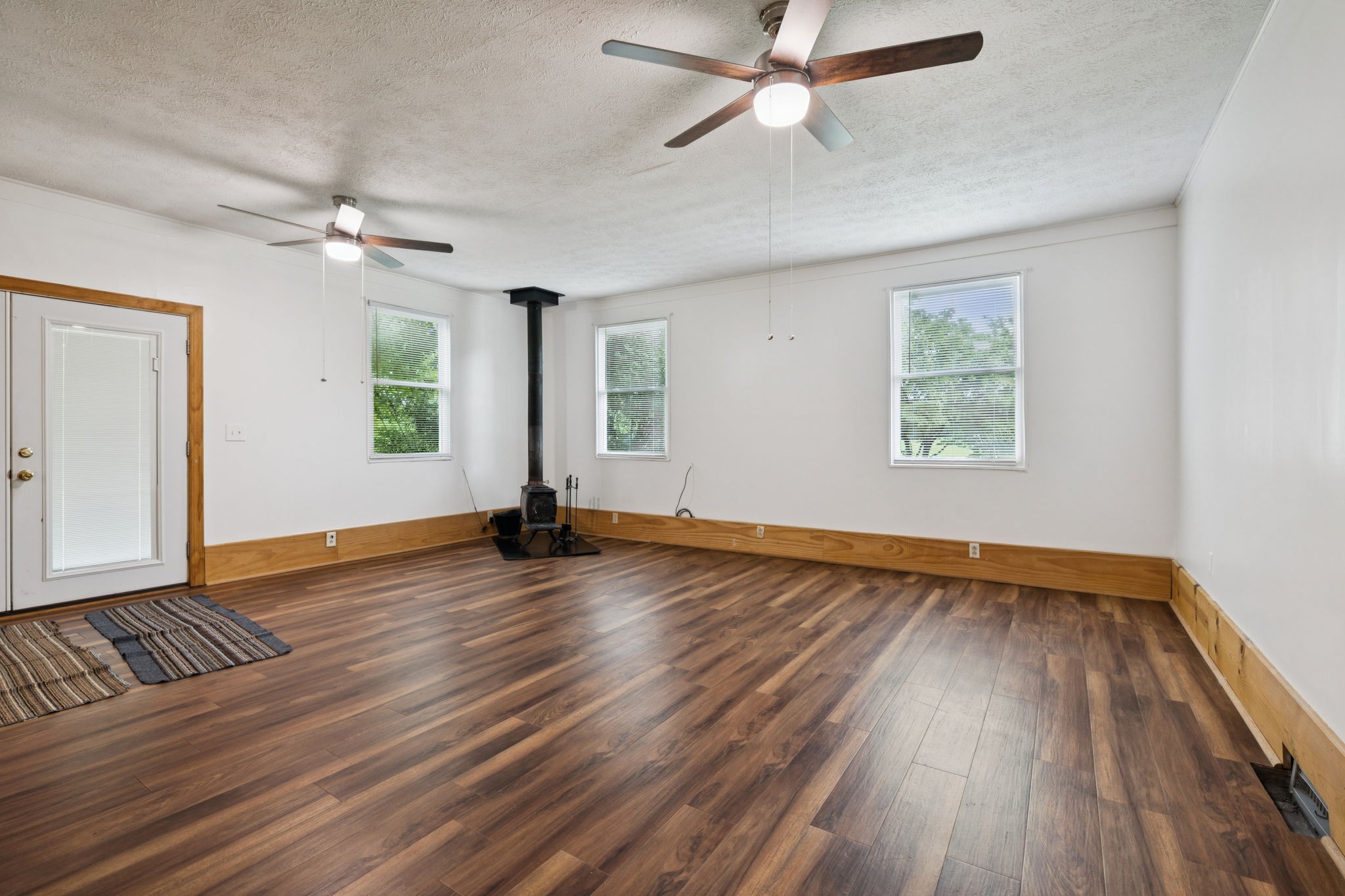 115 White Road Portland, TN 37148 - Photo 22 of 44 a view of an empty room with wooden floor and a window
