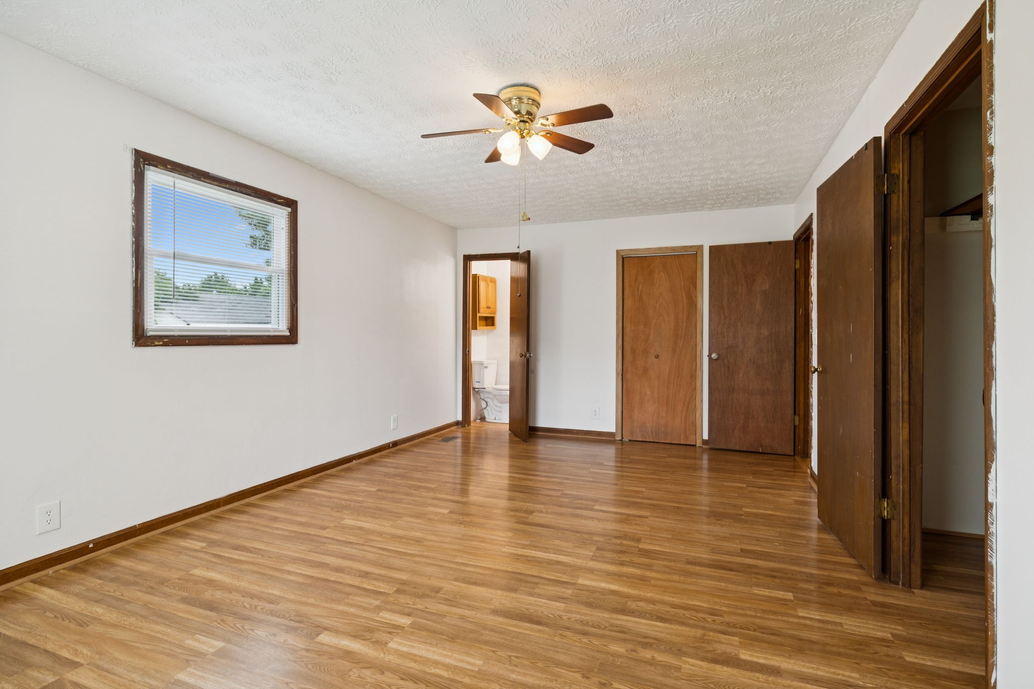 115 White Road Portland, TN 37148 - Photo 27 of 44 a view of an empty room with wooden floor and a window