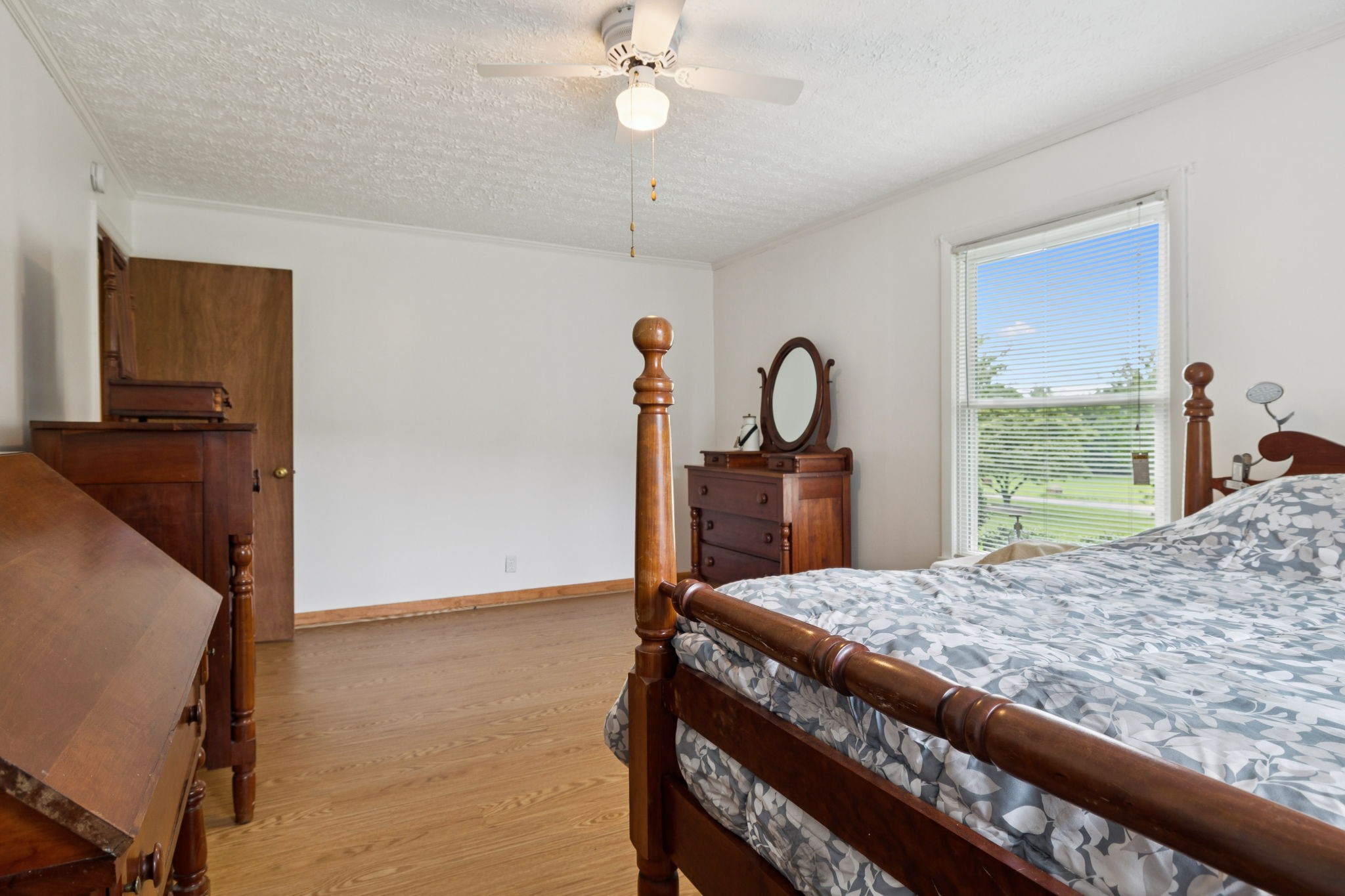 115 White Road Portland, TN 37148 - Photo 29 of 44 a bedroom with a bed and a dresser with mirror