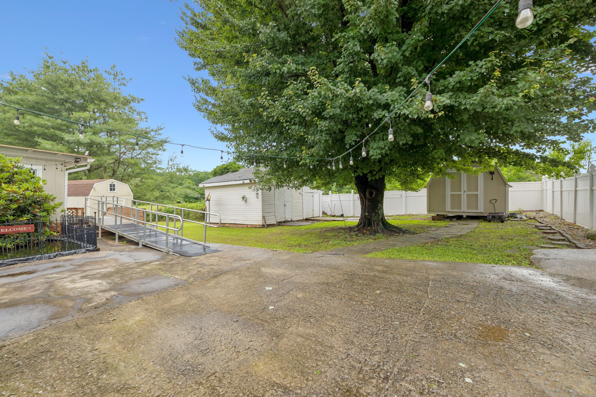 115 White Road Portland, TN 37148 - Photo 38 of 44 a view of a house with large tree and wooden fence