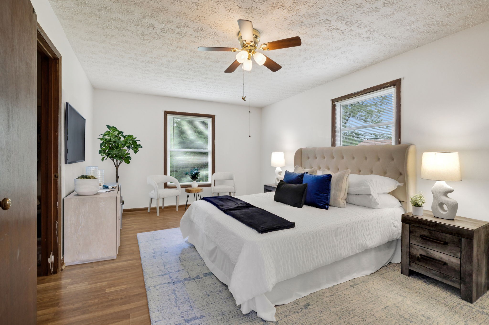 115 White Road Portland, TN 37148 - Photo 10 of 44 a bedroom with a bed and a chandelier