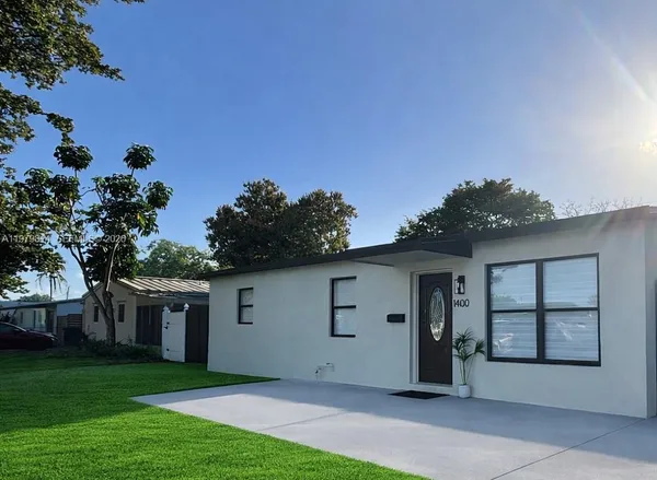 front view of a house with a garden