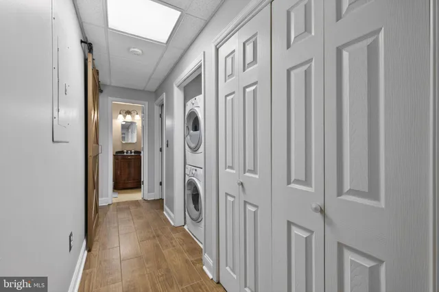 a view of a hallway with a door
