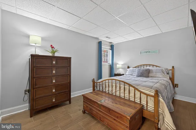 a bedroom with a bed and a dresser