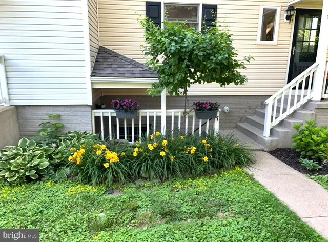 a view of a house with a flower garden