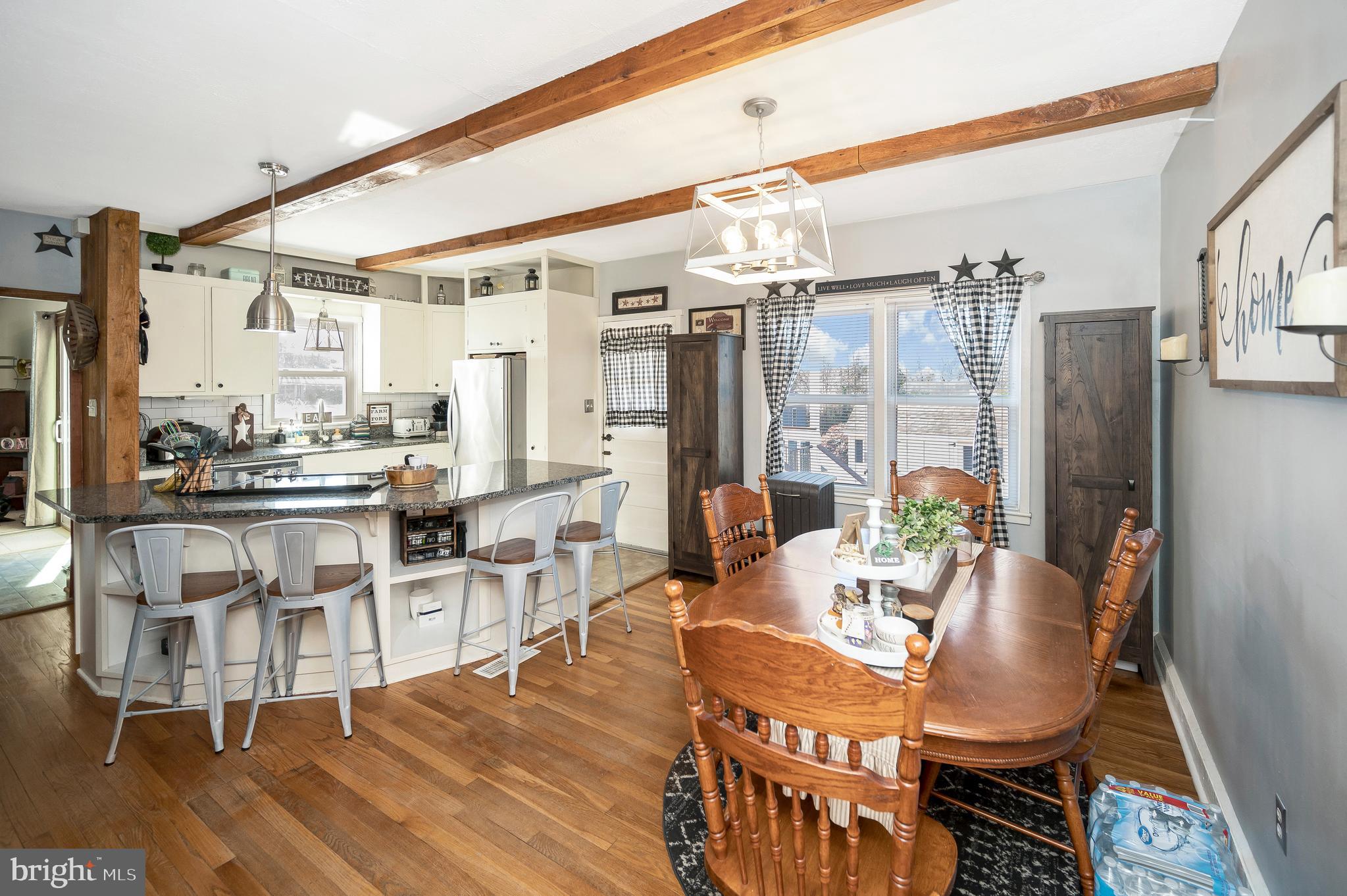 29 Leeland Road Fredericksburg, VA 22405 - Photo 12 of 30 a dining room with furniture a chandelier and wooden floor