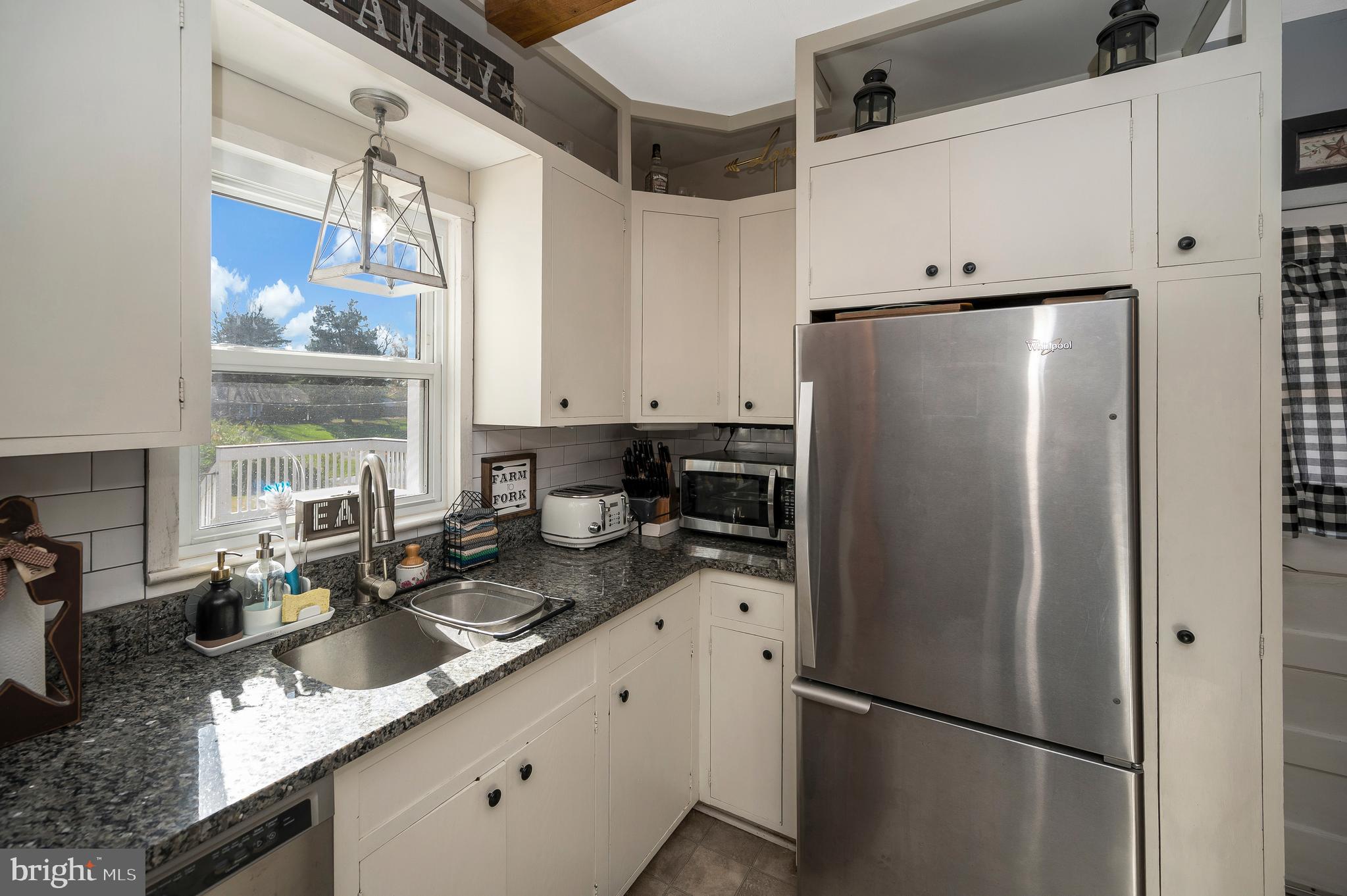 29 Leeland Road Fredericksburg, VA 22405 - Photo 16 of 30 a kitchen with stainless steel appliances granite countertop a refrigerator a sink and white cabinets