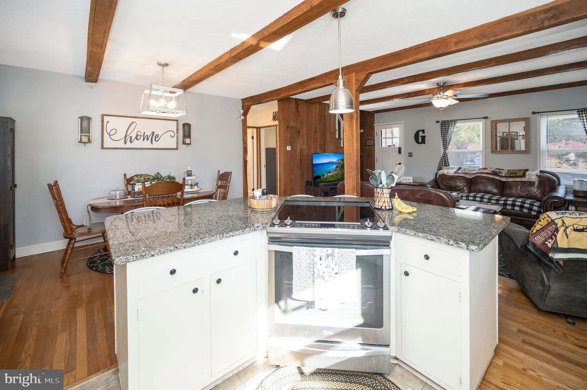 29 Leeland Road Fredericksburg, VA 22405 - Photo 18 of 30 a kitchen with granite countertop a stove and white cabinets