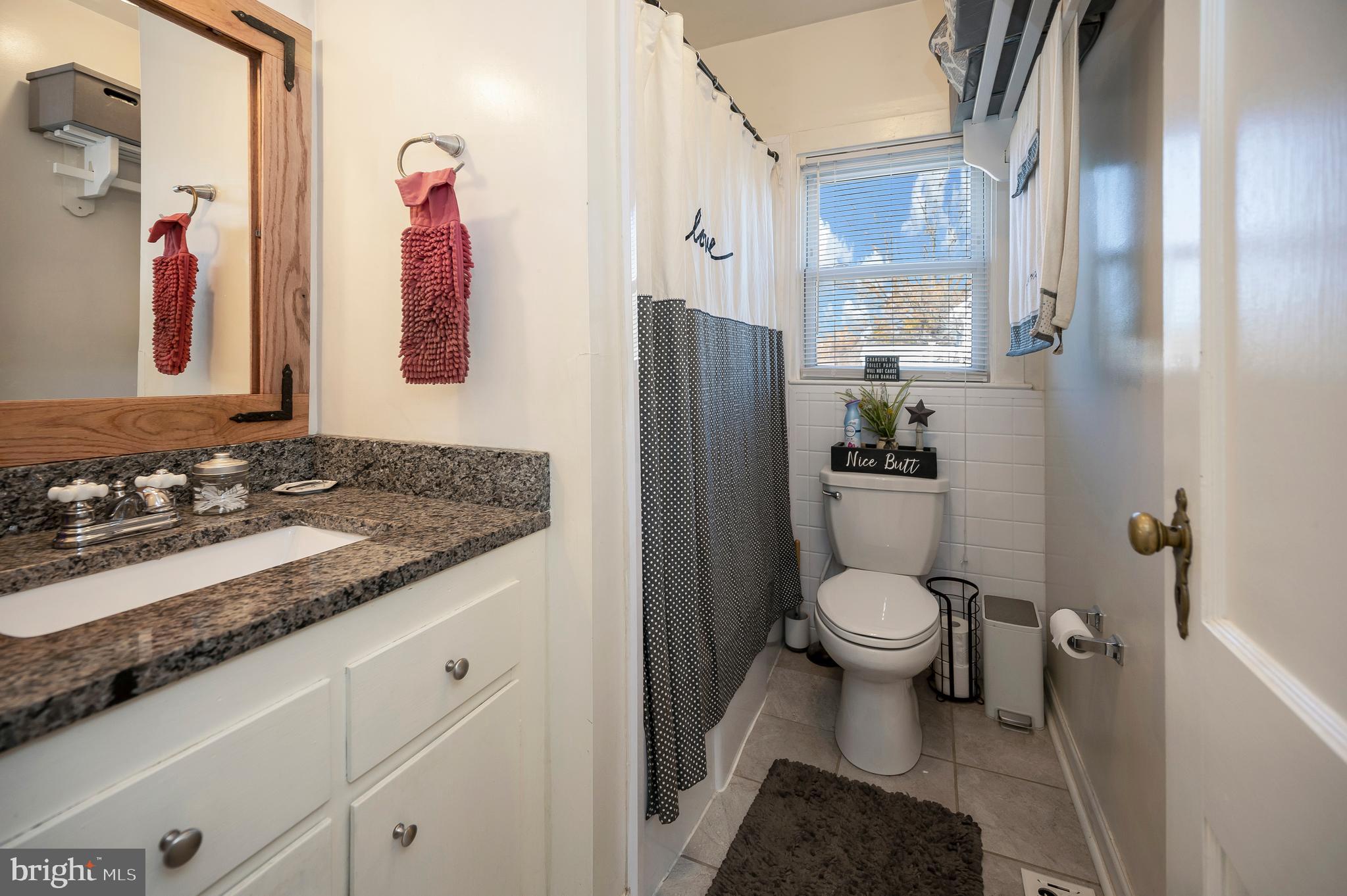 29 Leeland Road Fredericksburg, VA 22405 - Photo 22 of 30 a bathroom with a granite countertop sink toilet and shower