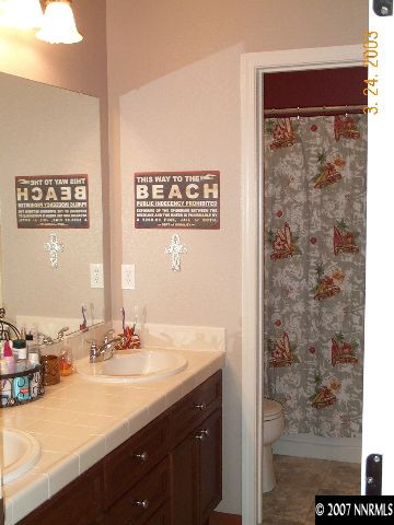 10520 Blockade Drive Reno, NV 89521 - Photo 6 of 9 a bathroom with a sink and a mirror
