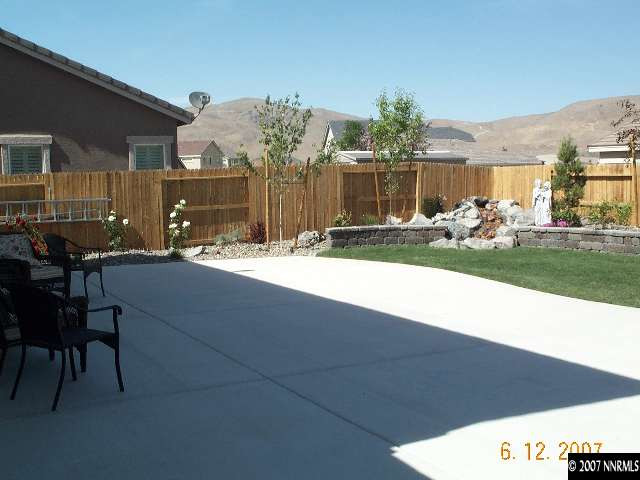 10520 Blockade Drive Reno, NV 89521 - Photo 8 of 9 a view of a house with a yard