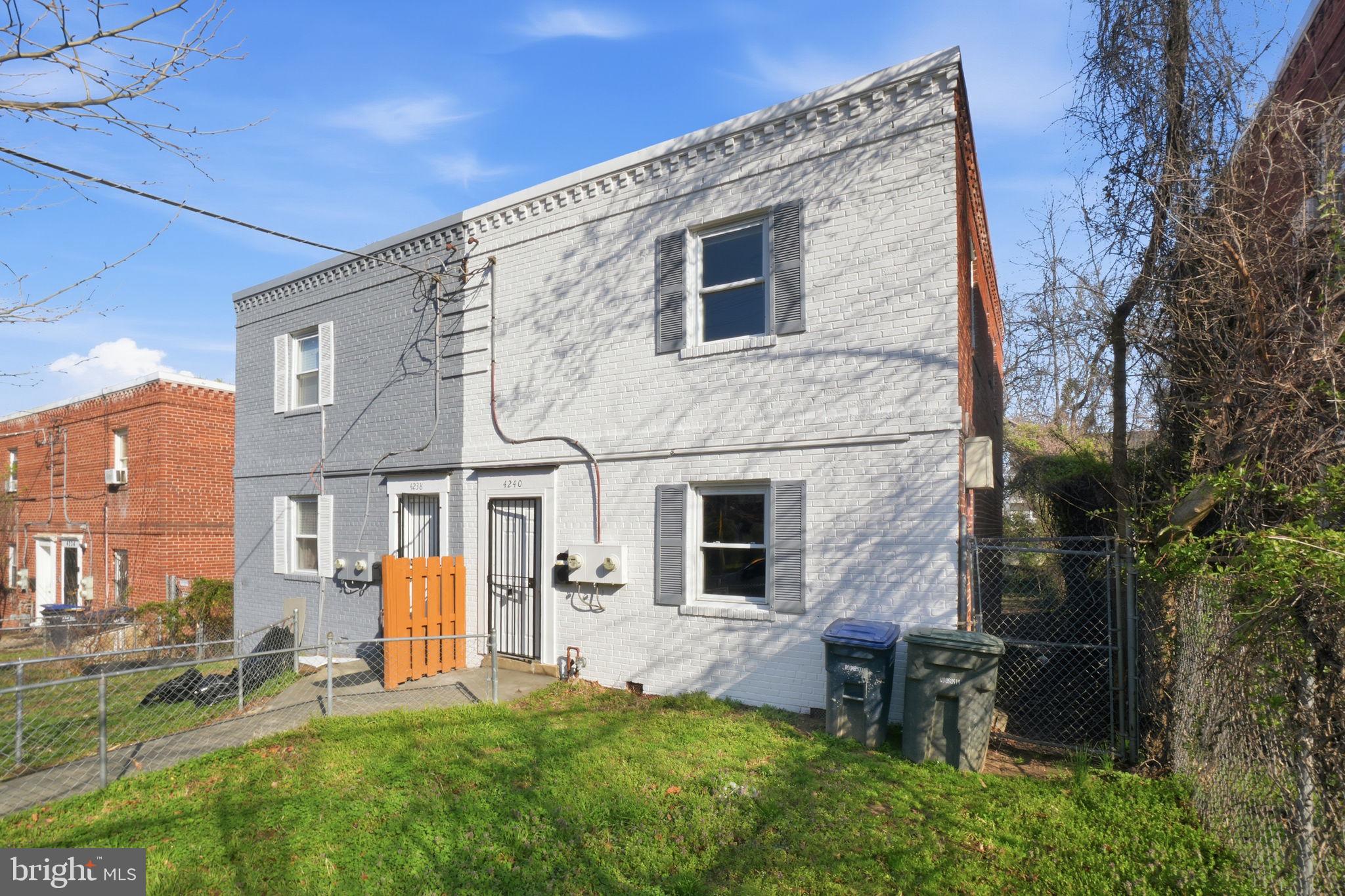 4240 Foote Street Northeast Washington, DC 20019 - Photo 1 of 38 a front view of a house with a yard