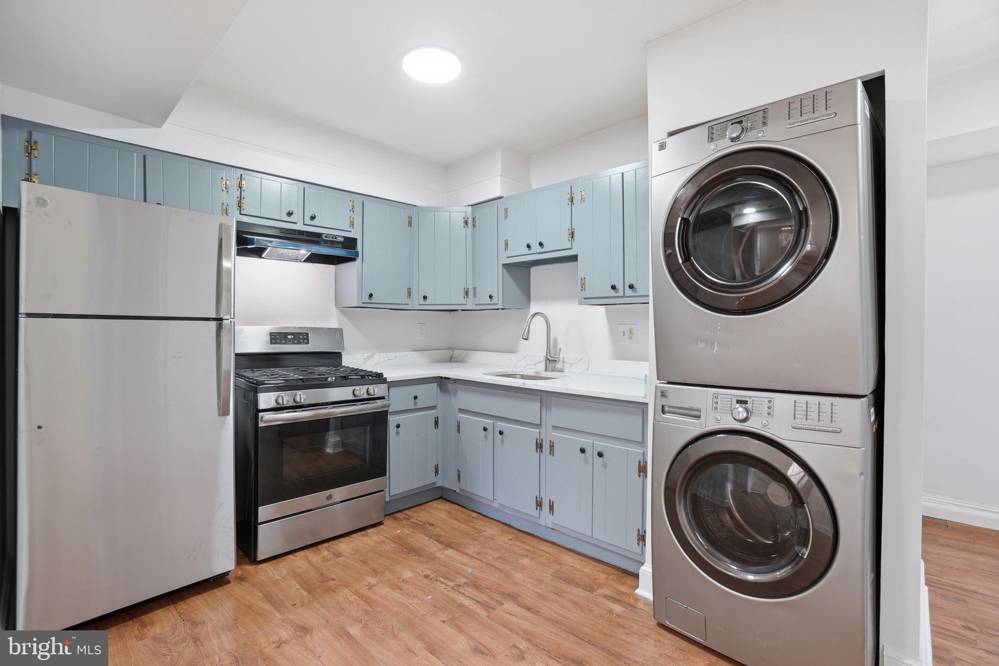 4240 Foote Street Northeast Washington, DC 20019 - Photo 12 of 38 a kitchen with a washer and dryer