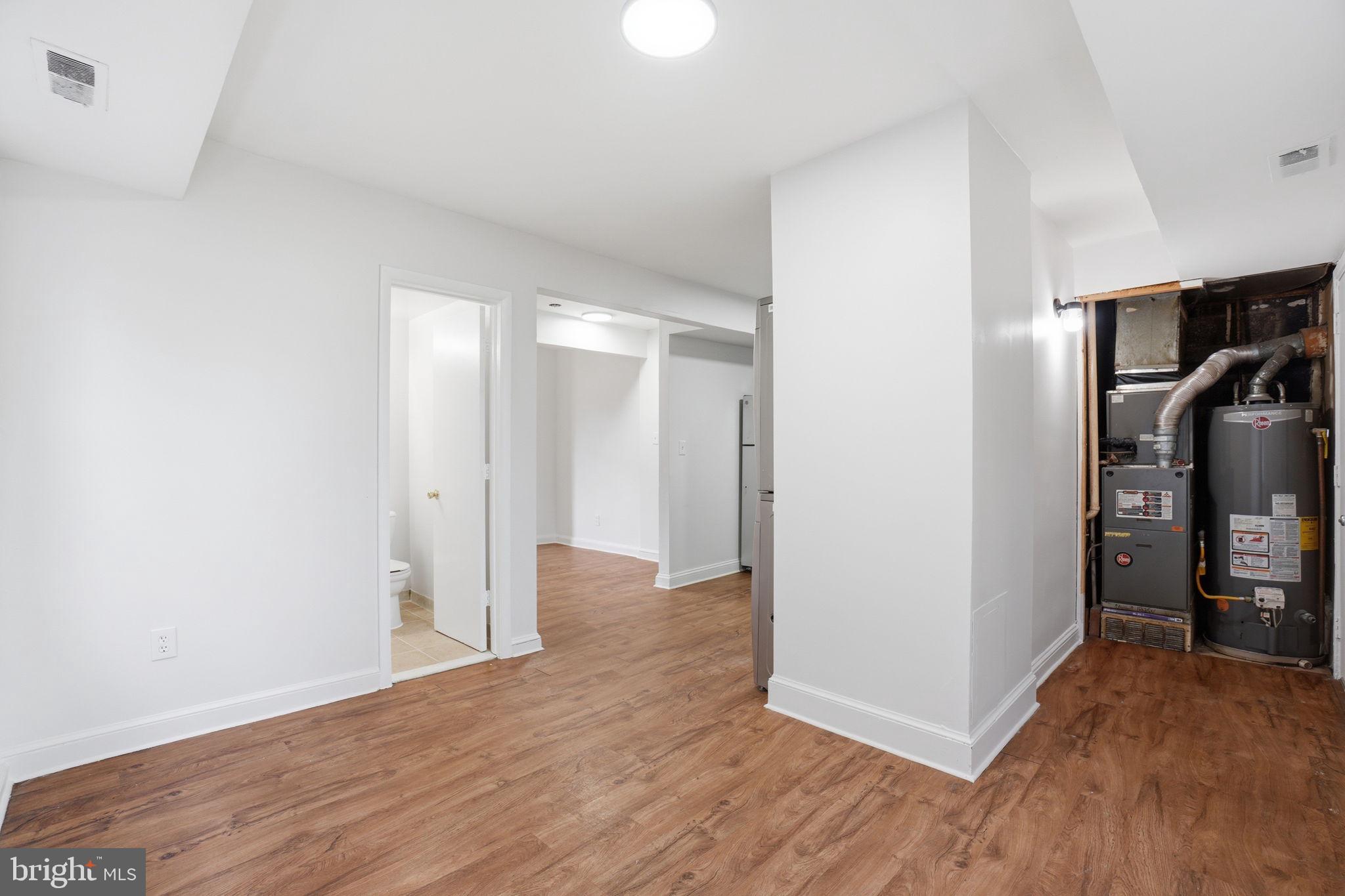 4240 Foote Street Northeast Washington, DC 20019 - Photo 15 of 38 a view of a room with wooden floor