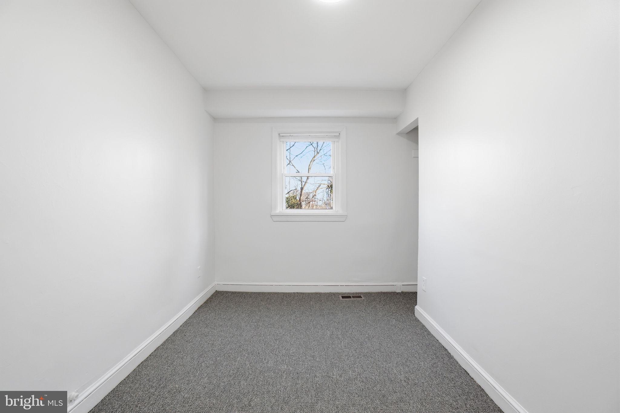 4240 Foote Street Northeast Washington, DC 20019 - Photo 20 of 38 an empty room with a window
