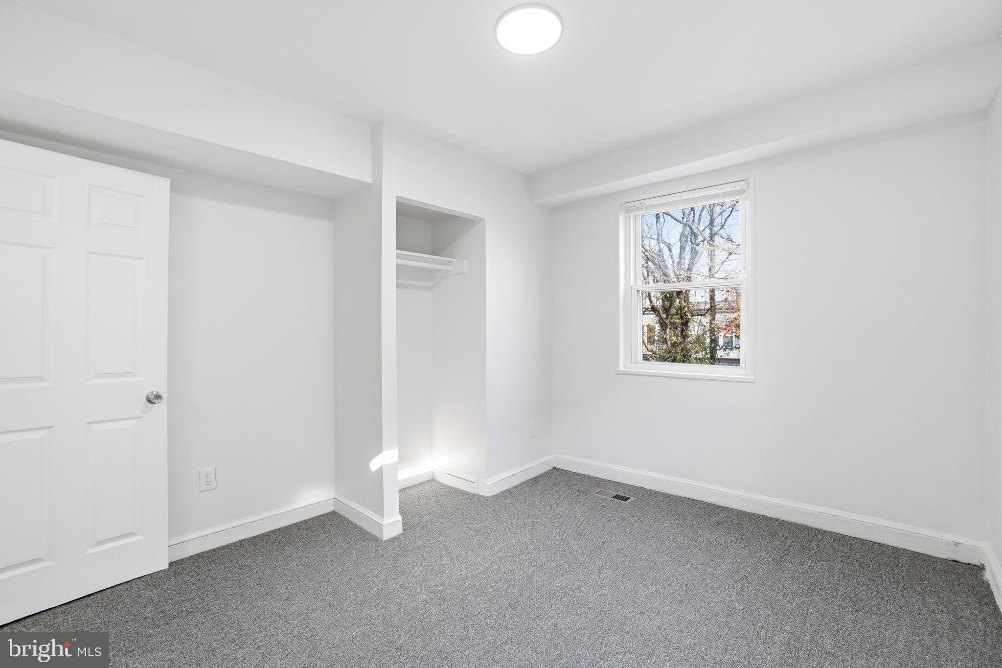 4240 Foote Street Northeast Washington, DC 20019 - Photo 23 of 38 an empty room with windows