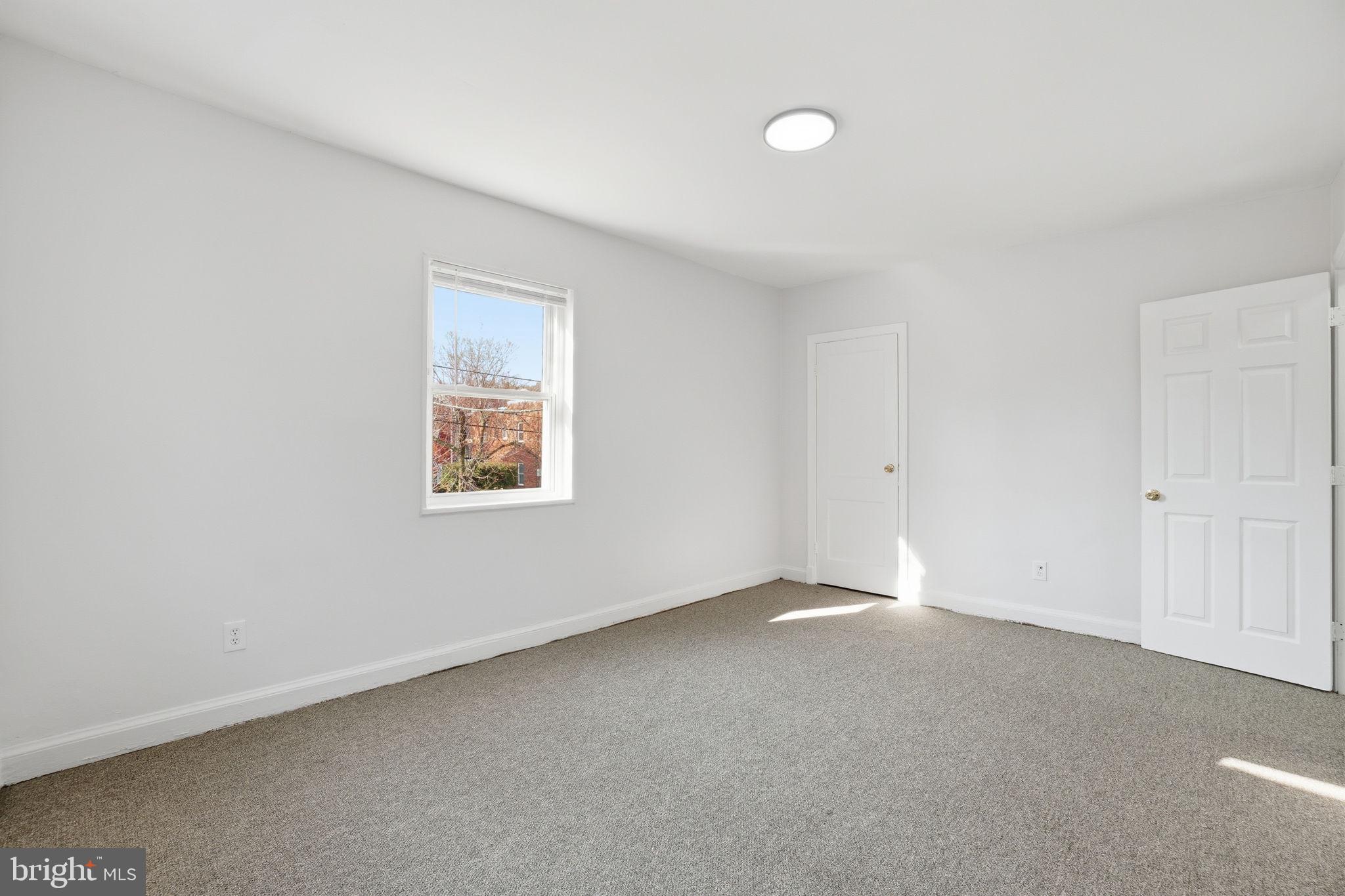 4240 Foote Street Northeast Washington, DC 20019 - Photo 27 of 38 an empty room with a window