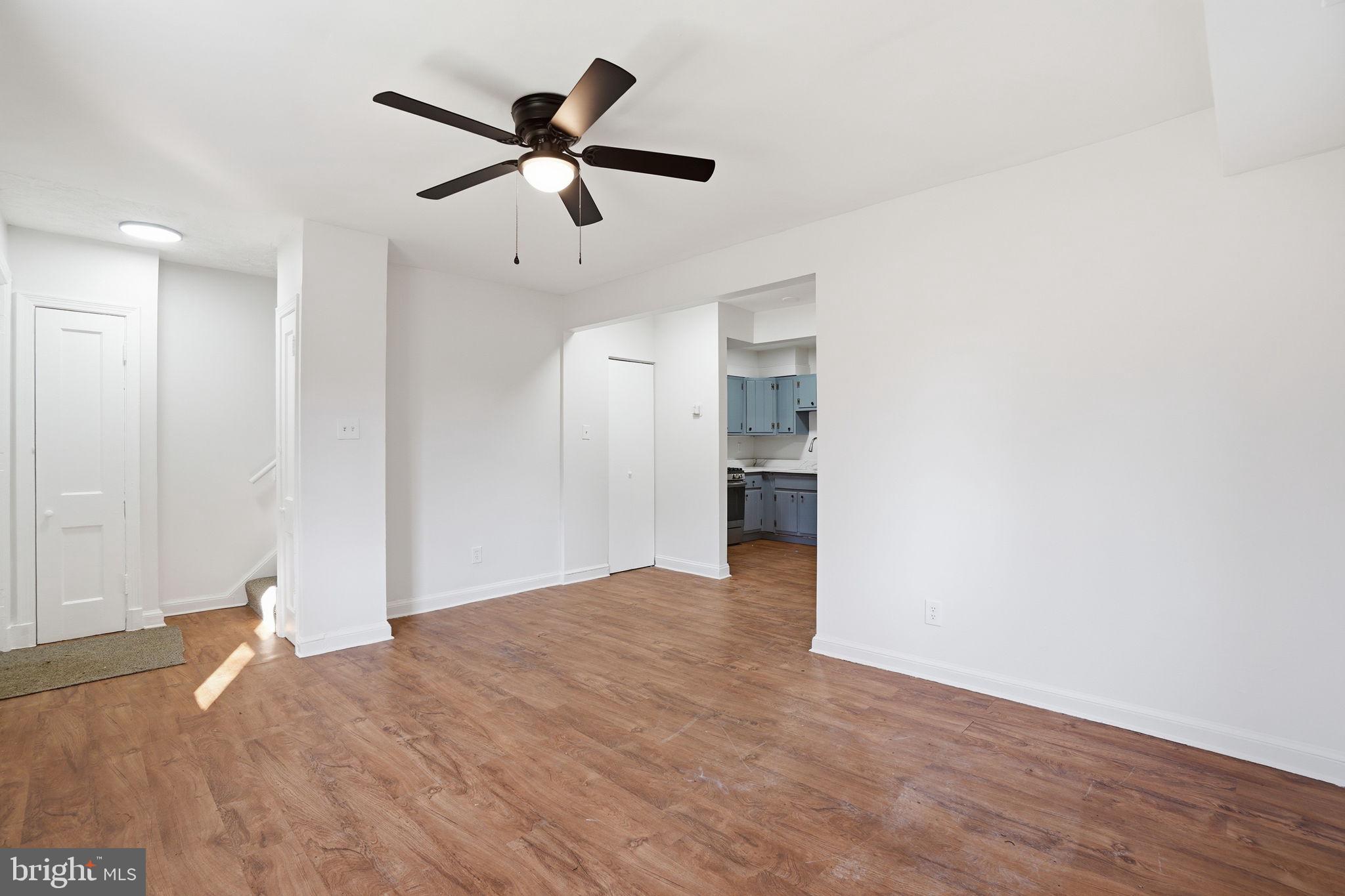 4240 Foote Street Northeast Washington, DC 20019 - Photo 3 of 38 a view of empty room with wooden floor and ceiling fan