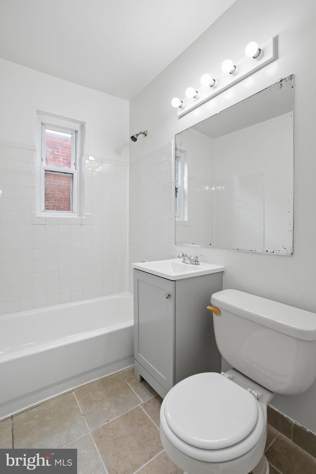 4240 Foote Street Northeast Washington, DC 20019 - Photo 31 of 38 a bathroom with a sink a toilet and shower