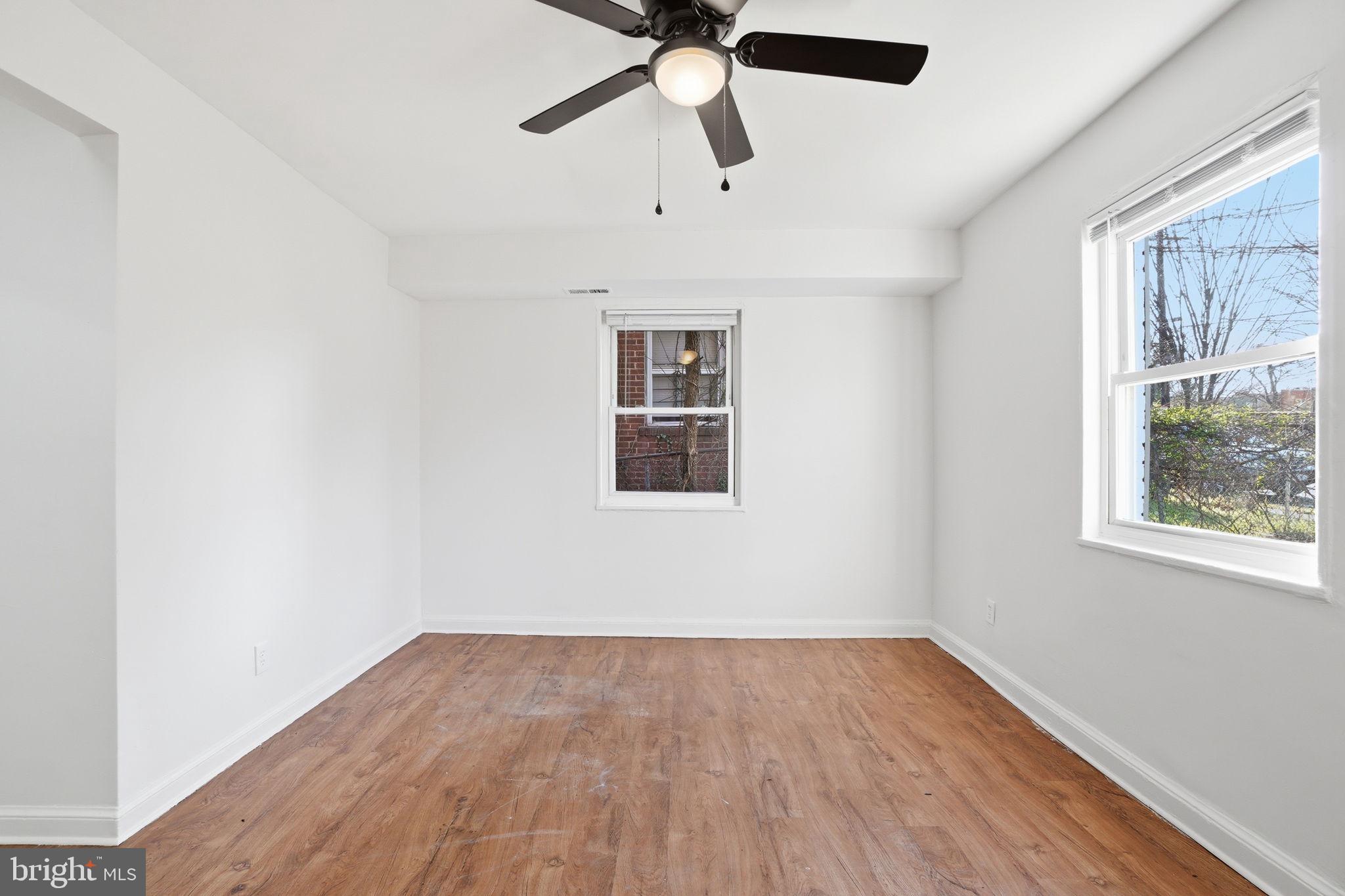 4240 Foote Street Northeast Washington, DC 20019 - Photo 6 of 38 a view of empty room with wooden floor and fan