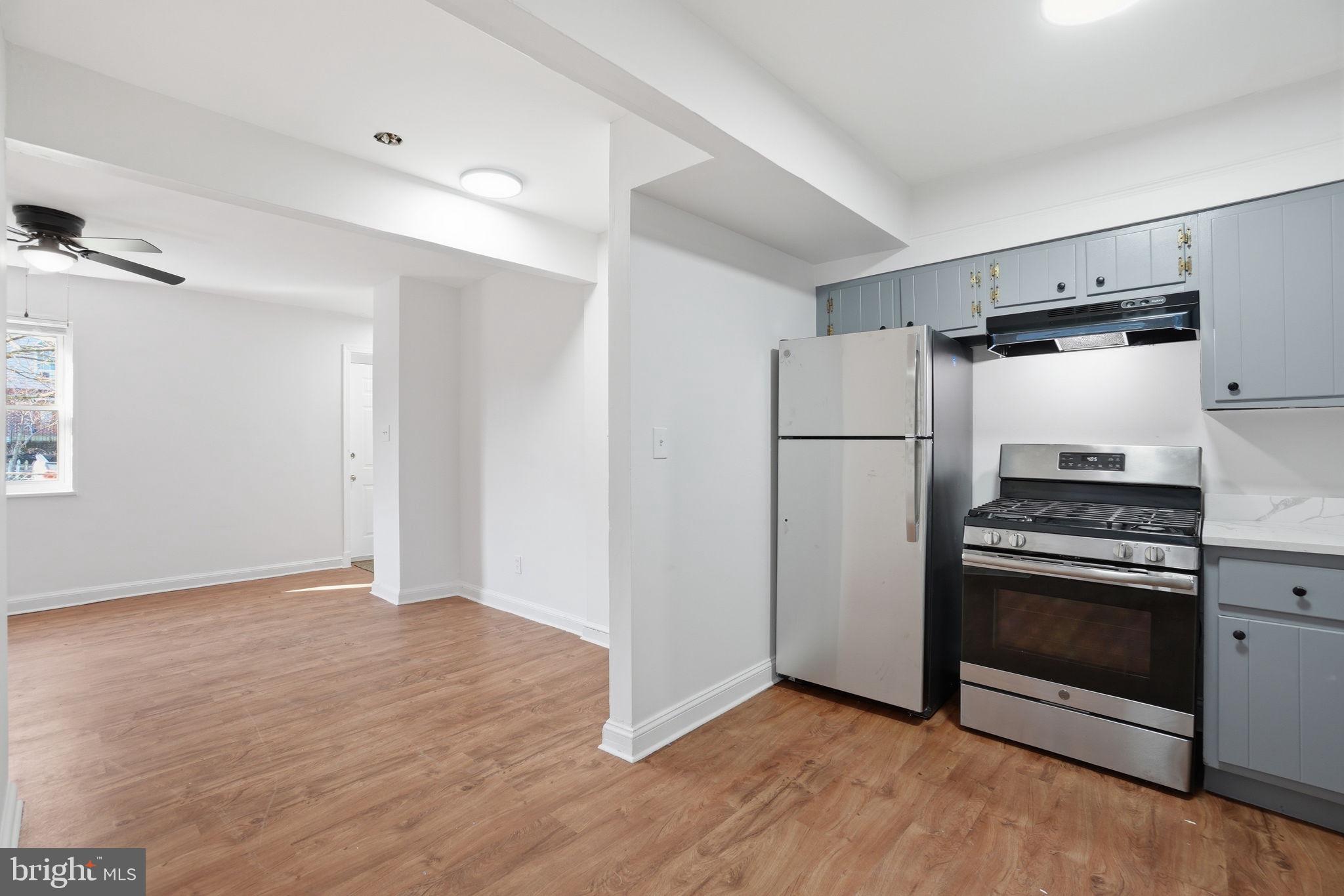 4240 Foote Street Northeast Washington, DC 20019 - Photo 8 of 38 a kitchen with a refrigerator and a stove top oven