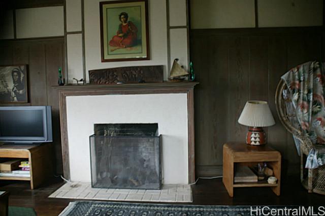2515 Manoa Road Honolulu, HI 96822 - Photo 1 of 1 a living room with furniture and a fireplace