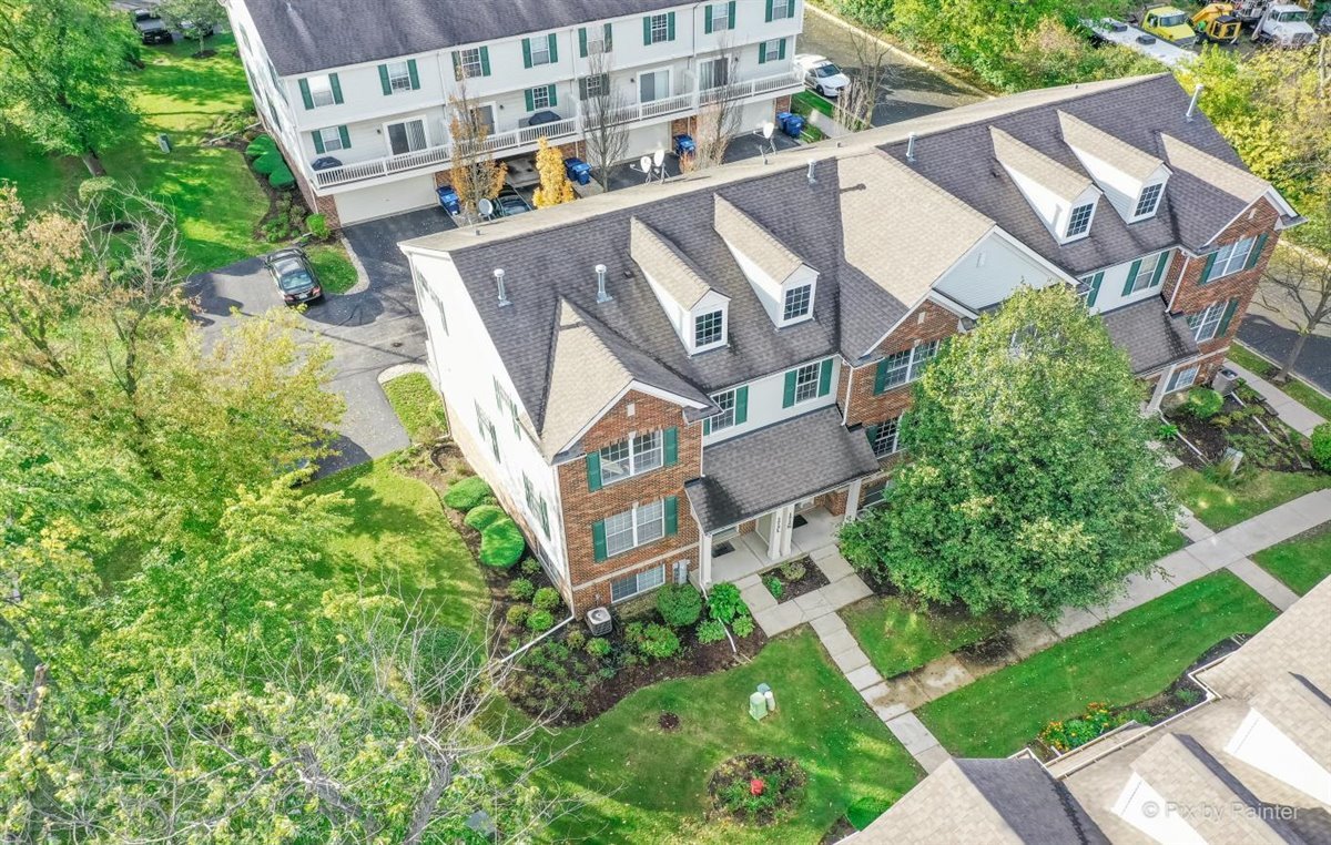 172 East River Road, Unit L Des Plaines, IL 60016 - Photo 2 of 27 an aerial view of a house with a garden space
