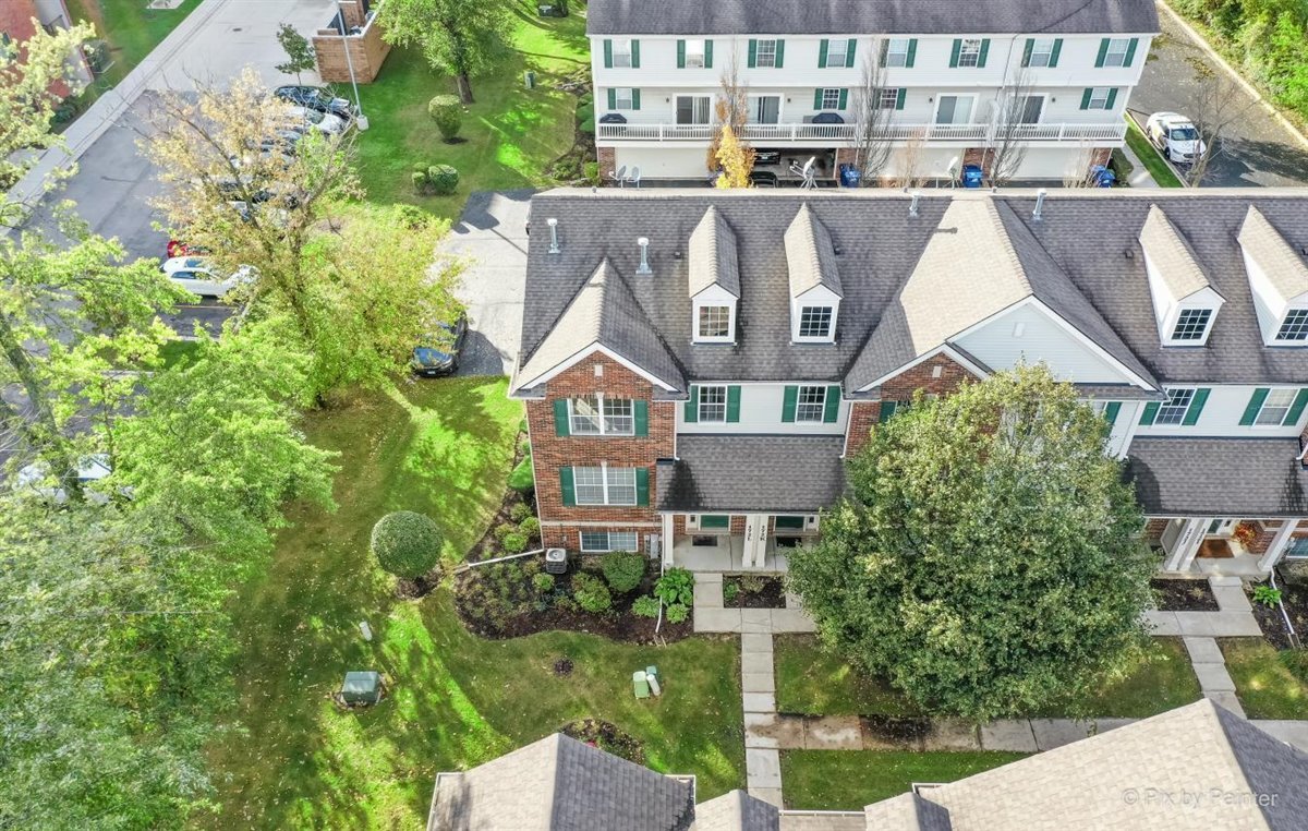 172 East River Road, Unit L Des Plaines, IL 60016 - Photo 27 of 27 aerial view of a house with a yard and potted plants