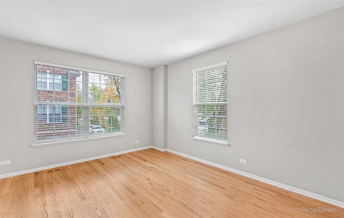 172 East River Road, Unit L Des Plaines, IL 60016 - Photo 6 of 27 a view of an empty room with a window