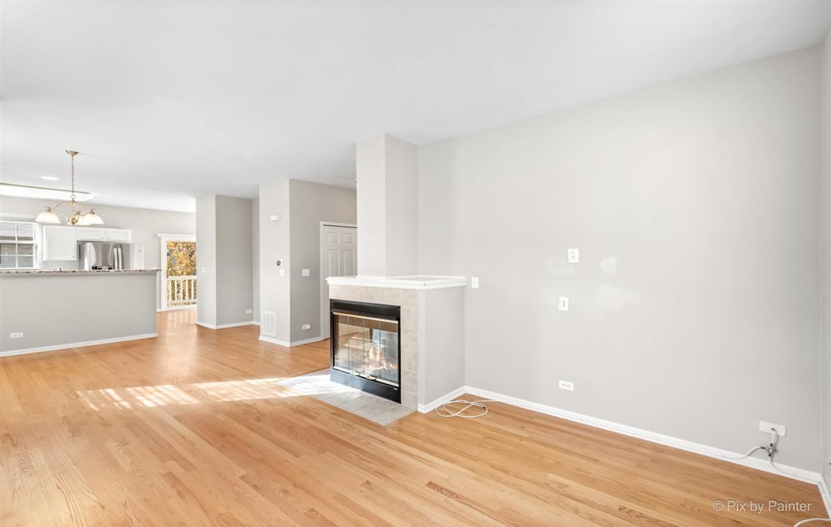 172 East River Road, Unit L Des Plaines, IL 60016 - Photo 7 of 27 a view of an empty room with a window