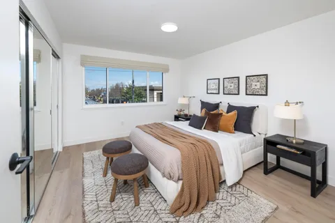 a bedroom with a bed and window