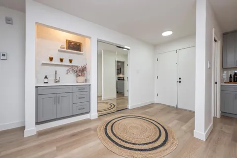 a view of a storage & utility room with closet dryer