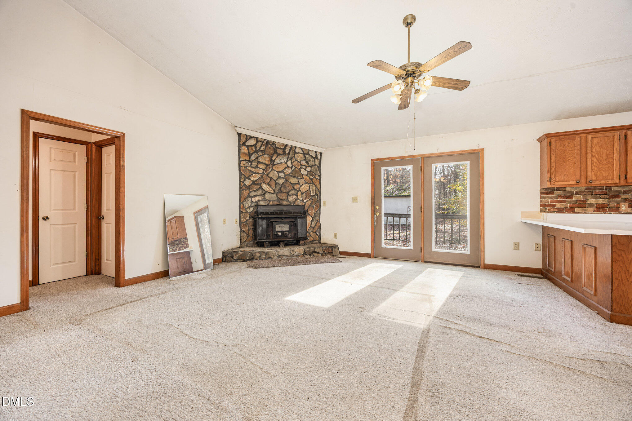 227 Bellview Road Robbins, NC 27325 - Photo 4 of 20 a view of an empty room with a fireplace and a window