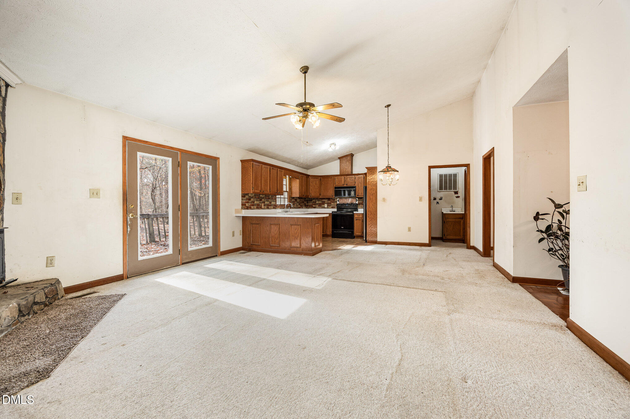 227 Bellview Road Robbins, NC 27325 - Photo 5 of 20 a open kitchen with a refrigerator and a sink