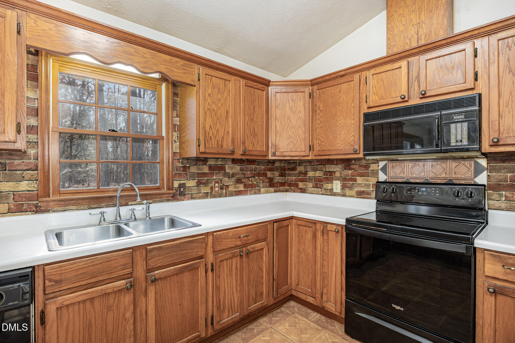 227 Bellview Road Robbins, NC 27325 - Photo 8 of 20 a kitchen with stainless steel appliances granite countertop a stove microwave and sink