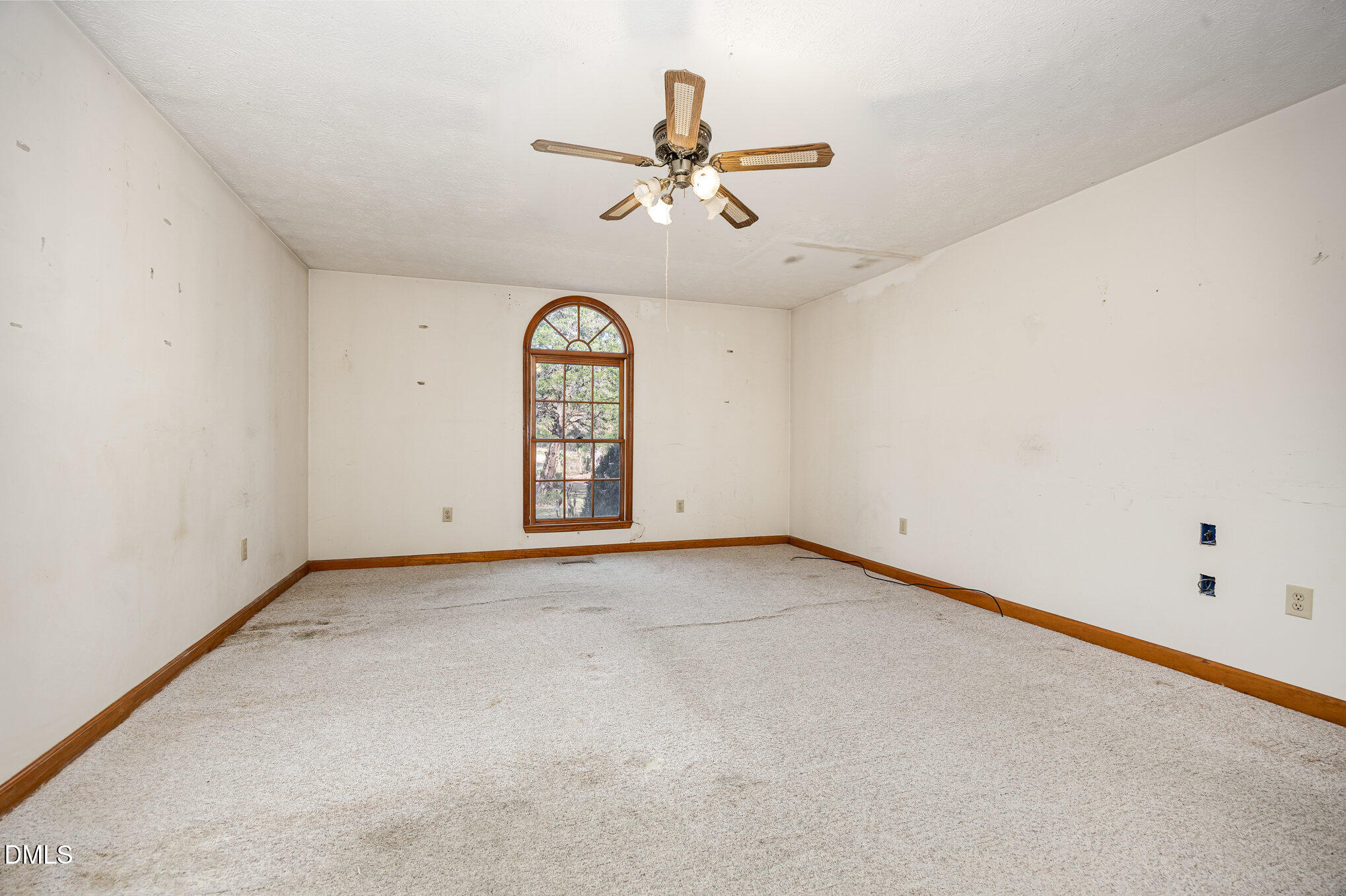 227 Bellview Road Robbins, NC 27325 - Photo 10 of 20 an empty room with a ceiling fan and window