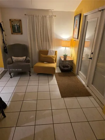 a living room with a couch and a large window