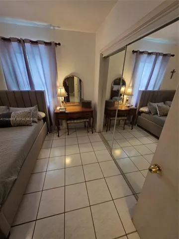 a living room with a couch and a fireplace